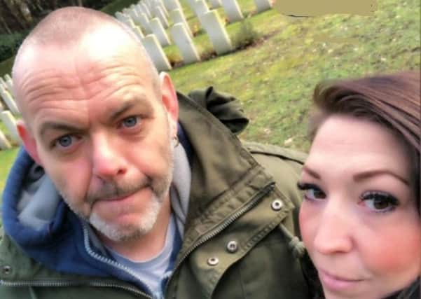 John and Sharon Esser, a Dutch couple who have adopted the grave of a British war hero EMN-210302-085447001