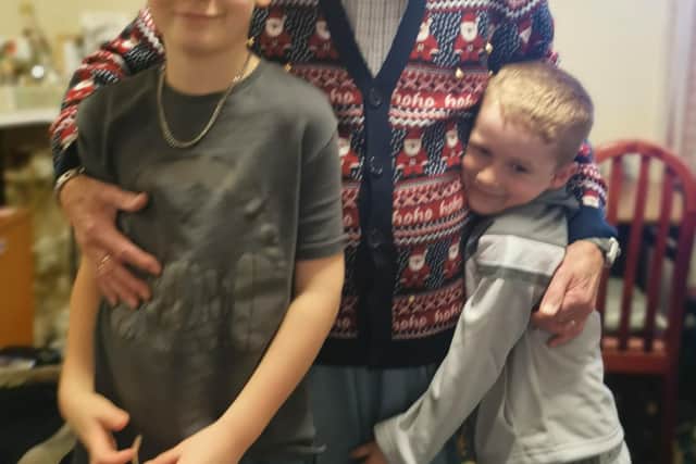 Geoff Skerritt (90) pictured with his grandsons EMN-210702-154600001