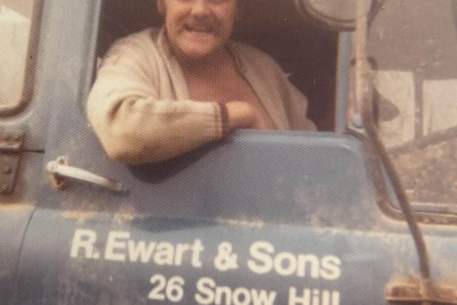 The late Pip Ewart pictured in the cab of a truck while working in the family business EMN-211202-172759001