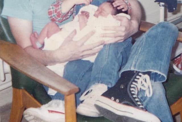 The late David Slocombe pictured with one of his baby sons EMN-210221-173710001