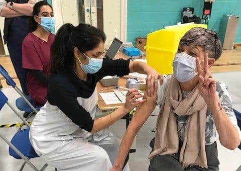 Latham House GP Dr Fahreen Dhanji gives a coronavirus jab to a patient at the vaccination centre at Melton Sports Village EMN-210221-103815001
