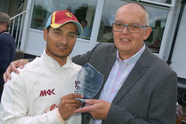 Egerton Park chairman David Glover presents batsman Zaheer Hussain with the Melton Times Cricketer of the Year award before a match ub July 2016 EMN-210223-111241001