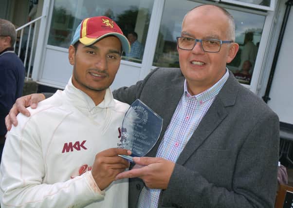 Egerton Park chairman David Glover presents batsman Zaheer Hussain with the Melton Times Cricketer of the Year award before a match ub July 2016 EMN-210223-111241001