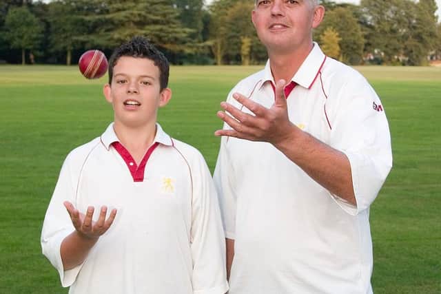 The late David Glover pictured with his son, Tom, at Egerton Park Cricket Club in 2007 EMN-210223-112231001