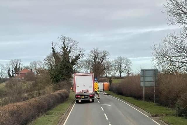 The bin lorry on its side on the A607 near Frisby this lunchtime
PHOTO PETER OMMIS EMN-210223-132005001
