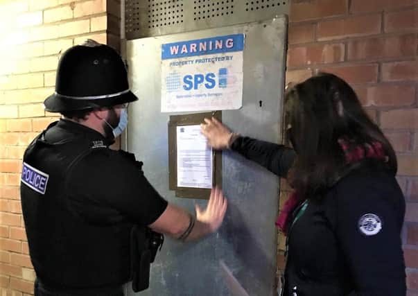 Melton police officer Pc Davey Rawlings puts up a notice to enforce a court order for the closure of 65 Rutland Street, Melton, for the next three months due to anti-social behaviour at the address EMN-210226-184126001