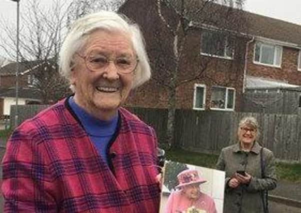 Nancy Bramall shows off her birthday card from The Queen as she celebrates her 100th birthday EMN-210903-161846001