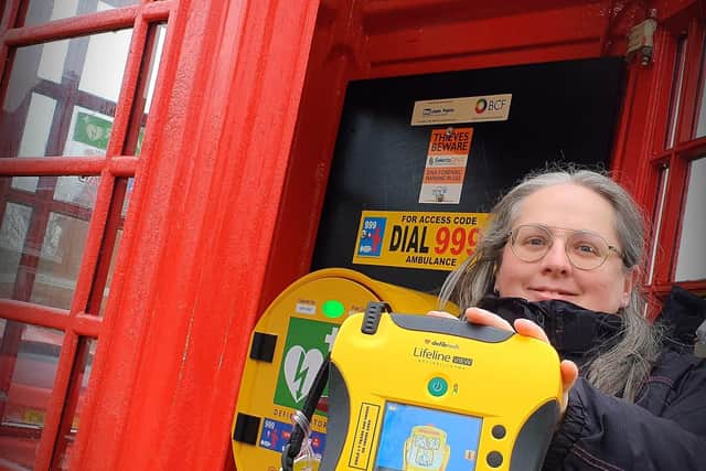 Cathie Gwilliam, clerk of Edith Weston Parish Council in Rutland, where a disused phonebox has been recommissioned for storage of the village defibrillator EMN-210316-094820001