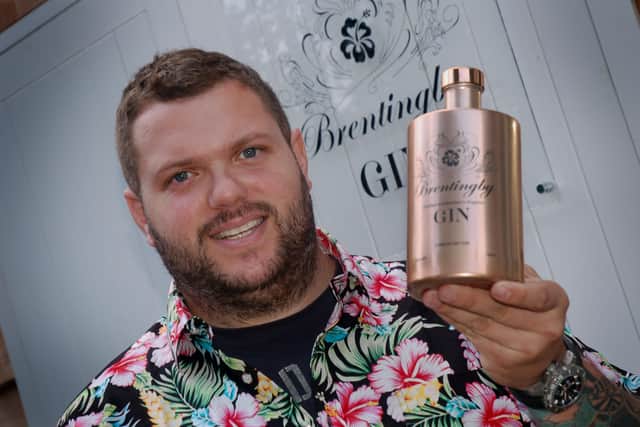 Bruce Midgley with a bottle of gin produced at his Brentingby Gin distillery near Melton EMN-210316-101003001