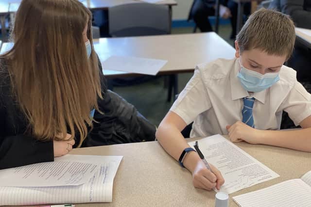 Students wearing masks in class as they returned to classrooms at Melton's Long Field Academy EMN-210317-112108001