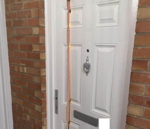 The door of a property in Melton town centre which police cut through with a chain saw to gain access to execute a drugs warrant EMN-210322-151445001