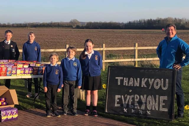 Andy Griffin with some of the children who have helped collect Easter eggs for students at Birch Wood Area Special School, from the left, Liam Roberts and Hannah Roberts (who spent all their piggy bank money to buy 40 eggs), Reuben Adams Finlay Adams and Willow Greenhough-Tampin EMN-210326-095035001