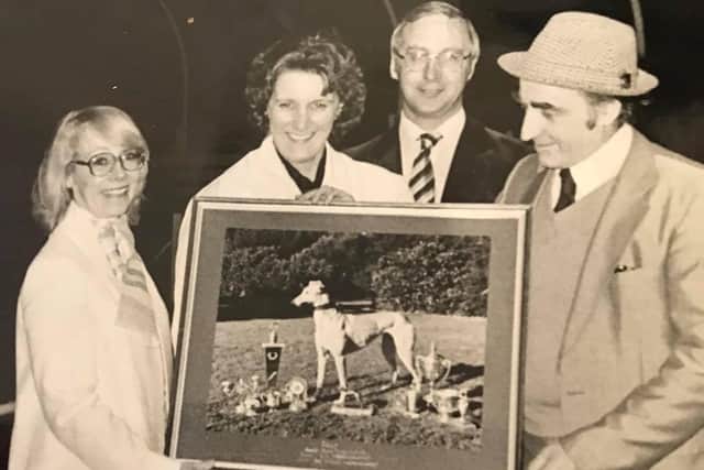 Aly Turner and wife Patricia with a photo of one of his greyhound champions EMN-210326-180830001