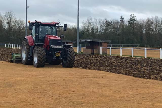 Work goes on on the pitch.