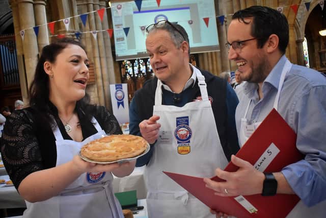 Rutland and Melton MP Alicia Kearns checks out one of the entries for the British Pie Awards with fellow judges, Hugh Brown (Melton Livestock Market) and Daniel Bennett (Duncan and Topliss) EMN-200403-133417001