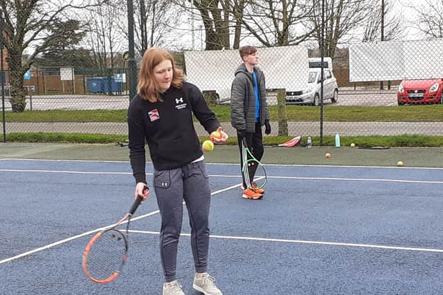 Amelia Coltman, a promising tennis player, gets back on court at Melton Sports Village to help out with junior training EMN-200503-162215002