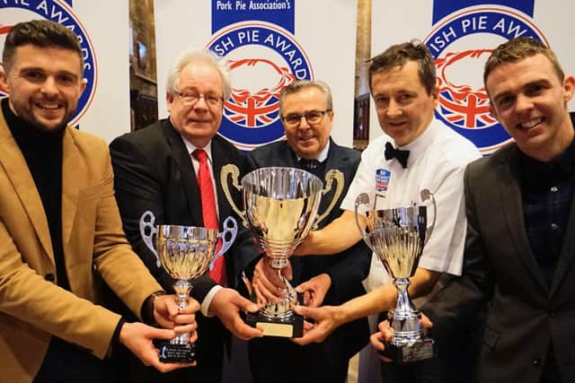 Turner's Pies show off their trophy haul from the British Pie Awards, with organiser Matthew O'Callaghan (second from left) and Dickinson and Morris MD Stephen Hallam (second from right) EMN-200603-161456001