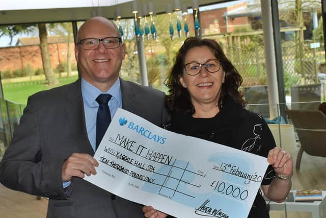 Ragdale Hall Spa directors Hugh Wilson and Allison Garner with a cheque for £10,000 to be allocated once again to community groups, charities and clubs through our Make It Happen funding scheme EMN-200313-123421001