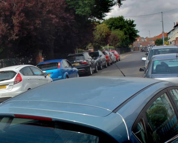 Parked cars in Melton - there may soon be a ban on parking on pavements EMN-200313-110957001