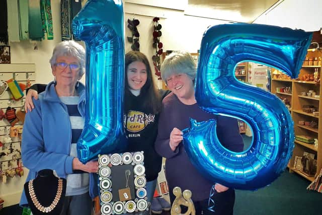 Volunteers Sue Jenkins and Maggie Joy with director Helen Chadwick pictured as the Fairtrading Post celebrates its 15th birthday in Melton EMN-200316-121540001