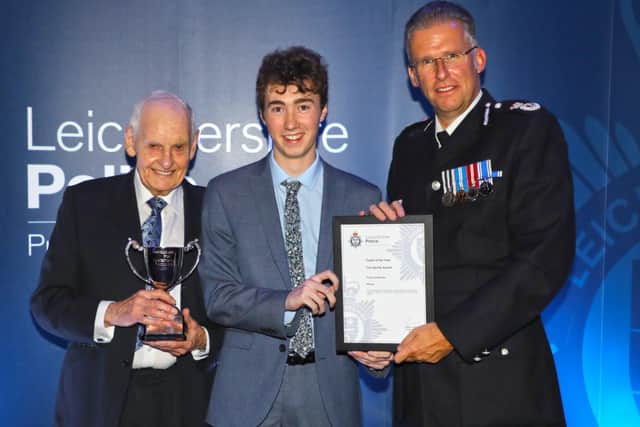Melton Police Cadet Finley O'Riordan is pictured being presented with his award for being named Leicestershire cadet of the year by Chief Constable Simon Cole EMN-200324-115908001