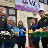 Holwell manager Neil Miller (left) and Ian Bitmead deliver donations from the club and Melton Learning Hub to MCS carers, from left, Claire Mousley, Krystyana Munday, and Gemma Fare EMN-200325-114754002