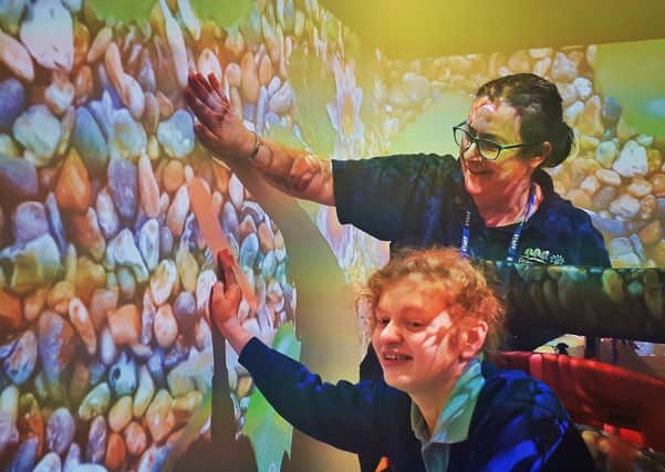 Birch Wood Area Special School staff member Sarah Criddle enjoys one of the themes of the new Immersive Room with a pupilPHOTO TAKEN BEFORE NEW RESTRICTIONS ON SOCIAL DISTANCING EMN-200325-074726001