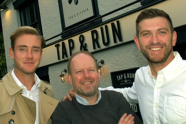 England cricketer Stuart Broad (left) with Notts CCC team-mate Harry Gurney (right) and director Dan Cramp outside their pub - the Tap and Run at Upper Broughton EMN-200331-095803001
