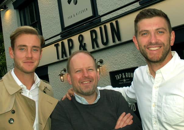 England cricketer Stuart Broad (left) with Notts CCC team-mate Harry Gurney (right) and director Dan Cramp outside their pub - the Tap and Run at Upper Broughton EMN-200331-095803001