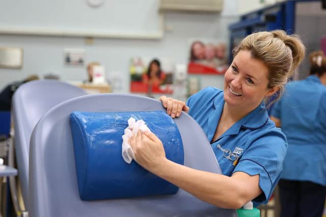 Blood donors have been urged to continue doing so during the coronavirus pandemic - an NHS staff member cleans the donation area to prevent any spread of the bug EMN-200304-091625001