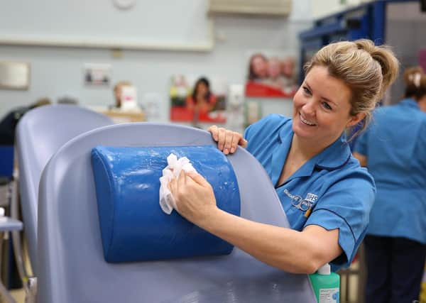 Blood donors have been urged to continue doing so during the coronavirus pandemic - an NHS staff member cleans the donation area to prevent any spread of the bug EMN-200304-091625001