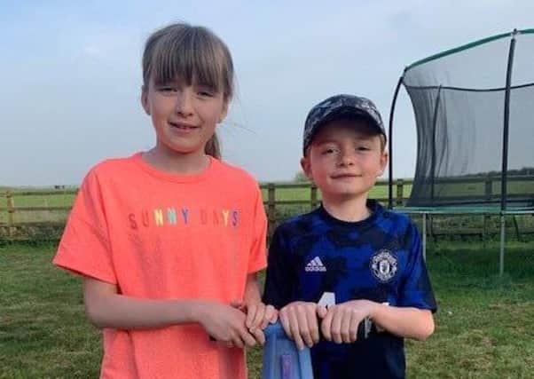 Isabel and Charlie Adkins, from Long Clawson, who are attempting to jump 20,000 times on a pogo stick in seven days to raise money for the NHS EMN-200417-092031001
