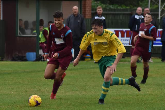 Holwell's new signing Alfie Gaughan in action against Radford EMN-190731-104908002