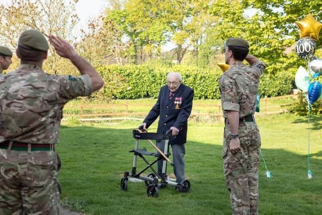Captain Tom Moore, who celebrates his 100th birthday today, pictured raising millions of pounds for the NHS by doing laps of his home EMN-200430-120111001