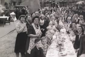 Residents who lived on streets off Burton Road, Melton, pictured during VE Day celebrations in May 1945 EMN-200505-123236001