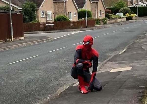 Spiderman, aka Melton sports coach Thomas Craig, patrols Edendale Road in Melton, as part of his quest to raise the spirits of children during the coronavirus lockdown EMN-201205-173005001