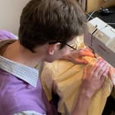 MV16 student Oliver Roberts busy making scrubs for NHS staff from unwanted bed sheets EMN-200513-145430001