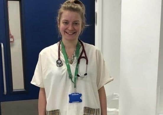 A staff member at The Whittington Hospital wears scrubs made by Melton student Oliver Roberts EMN-200513-142902001