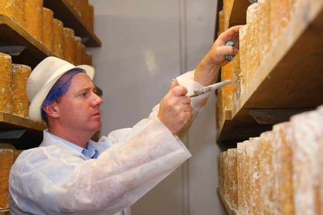 Billy Kevan, CEO, tests the Stilton at Colston Bassett Dairy EMN-200518-153337001