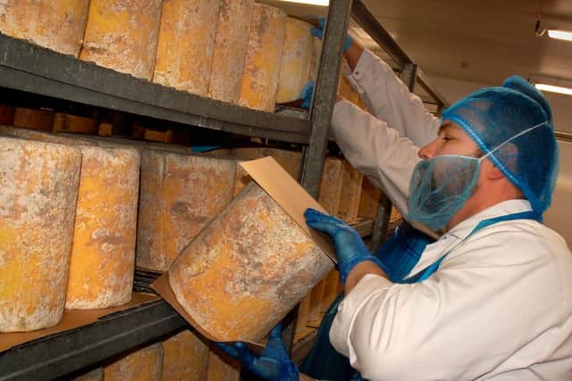Cheeses are turned daily during the maturation stage at Long Clawson Dairy
PHOTO TAKEN BEFORE SOCIAL DISTANCING WAS INTRODUCED EMN-200518-130845001