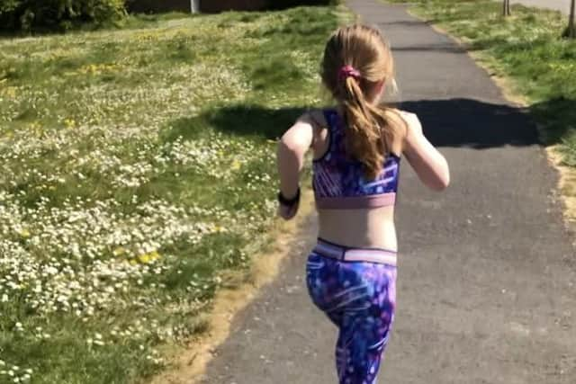 Dorrie McPherson running near her Melton home during her successful attempt to complete a total distance equivalent to a marathon EMN-200519-092058001