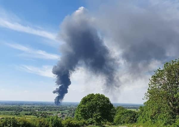A thick plume of black smoke coming from a blaze at Langar Airfield
PHOTO Craig Atkins EMN-200521-161947001