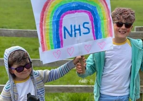 Waltham brothers Oliver and Toby Hill, who raised £700 for the NHS by doing a sponsored litter pick around their home village EMN-200522-101144001