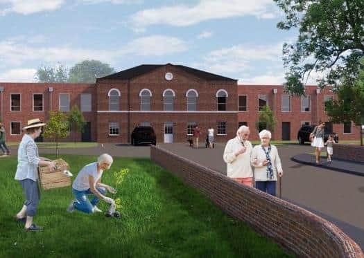 An artist's impression of the what the planned redevelopment of Melton's old St Mary's Hospital site might look like at the entrance to the site on Thorpe Road EMN-200526-154650001