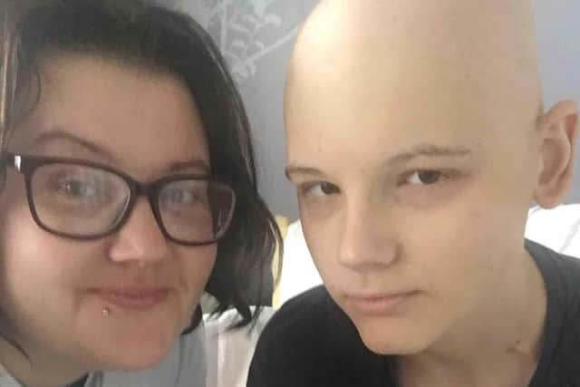 Charlie Hull, who has a rare form of cancer, with his mum Sam Smith EMN-200527-094207001