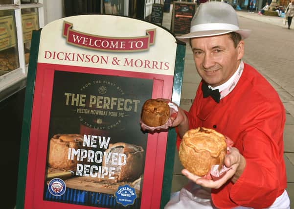 Managing director, Stephen Hallam, holding the iconic Dickinson and Morris Melton Mowbray pork pie outside Ye Olde Pork Pie Shoppe in Nottingham Street, Melton EMN-200106-160434001