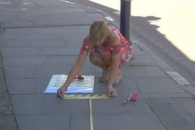Markings are placed on a Melton town centre pavement to enable safe social distancing for queuing customers EMN-200206-083402001