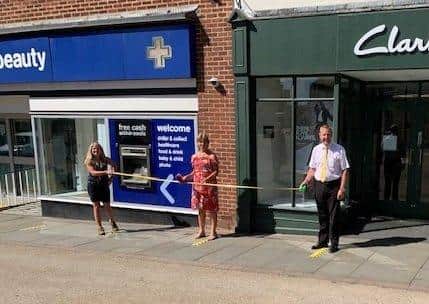 Safe social distancing being demonstrated in Melton town centre by, from left, borough council regulatory services manager, Victoria Clark, Melton BID Manager, Shelagh Core, and Melton Town Estate's Andrew Cooper EMN-200206-083412001