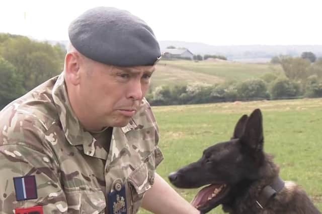 Warrant Officer Jonathan Tanner, chief instructor of the Canine Training Squadron at Melton's DATR camp, with patrol dog, Nicky EMN-200406-191115001