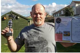 Dave Hutchings, a Syston builder who was treated by the air ambulance after falling from a ladder, shows off his fundraising certificate for the charity EMN-200806-082225001